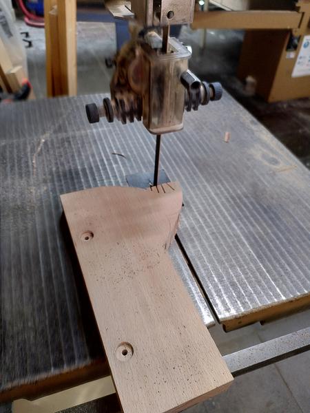 A piece of beech (fagus sylvatica) on a band saw table. The shame of a
saw has been cut out of it.